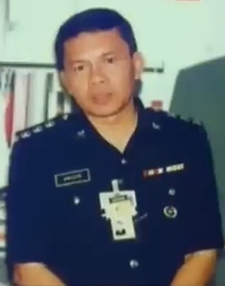Suspek diiringi anggota polis ke mahkamah